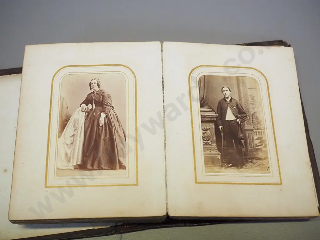 Victorian photo album with numerous photos, no dates or names, in tooled leather album, coming apart slightly H155 W115 Image 1++