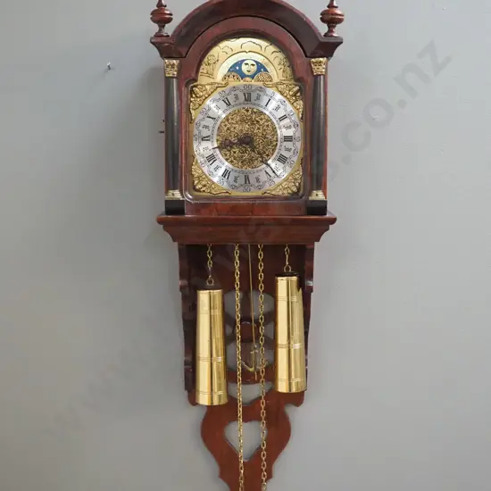 Dutch wall clock in ornate wooden case with 2 heavy brass weights, with moon phase dial, chipping to paint on grille on