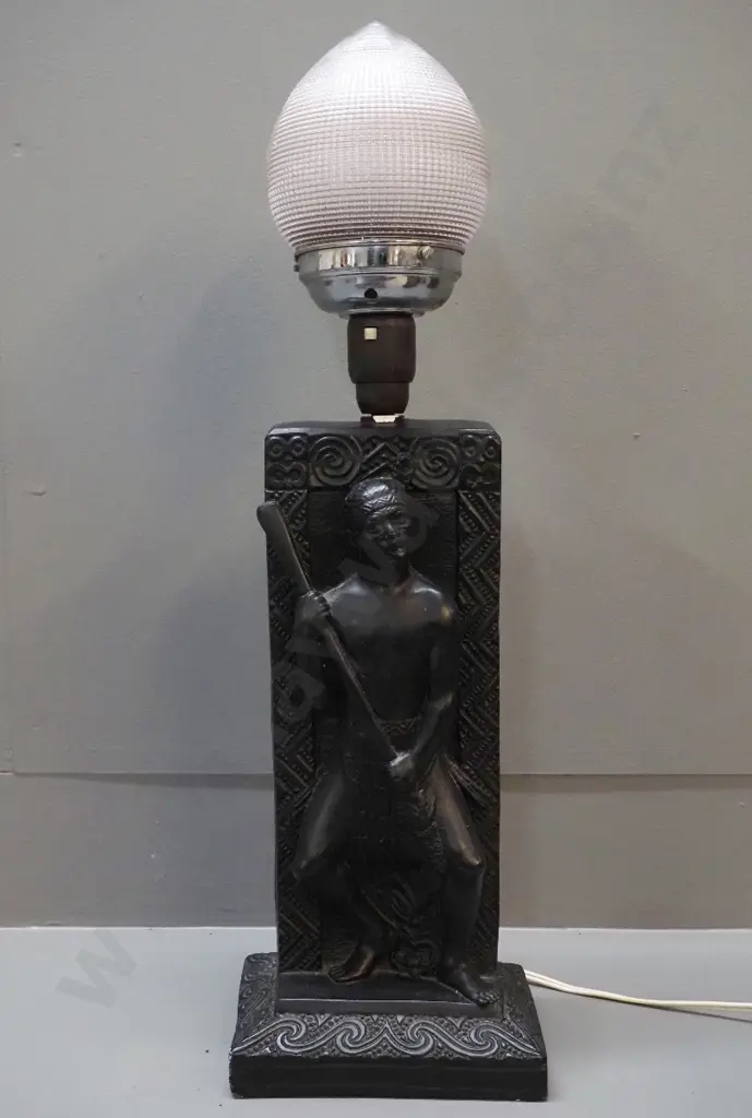 black painted plaster table lamp with Maori warrior relief motif, textured glass with chrome lamp holder. Chip to finish Image 1++