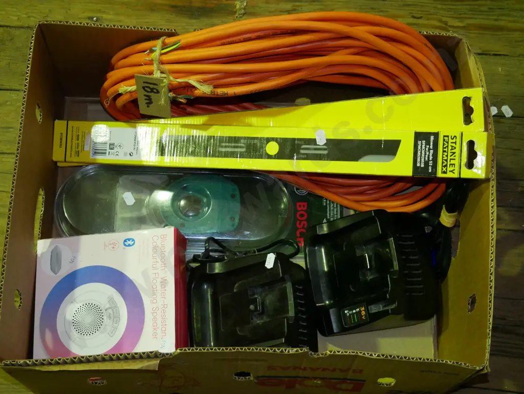 box; extension cords, mower blades, blue tooth floating speaker etc Image 1++