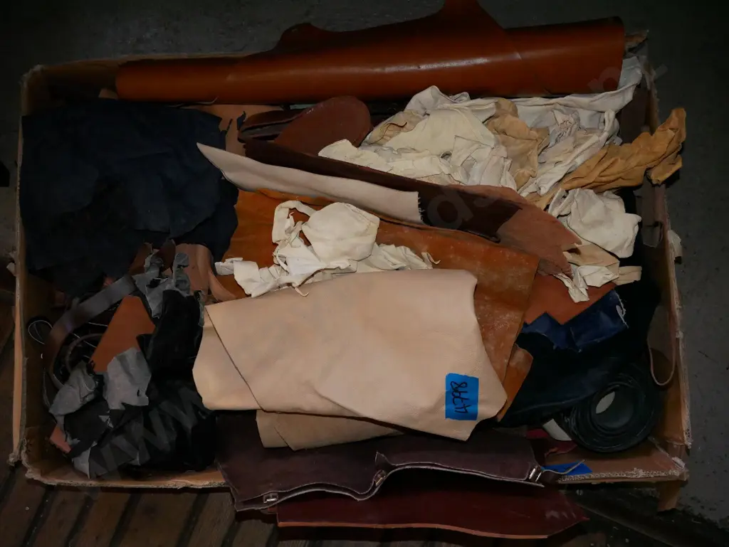large box of leather belts, other leather pieces Image 1++