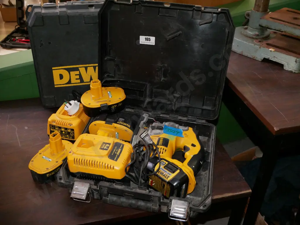 cased De Walt battery jig saw with 2 chargers and 4 batteries Image 1++