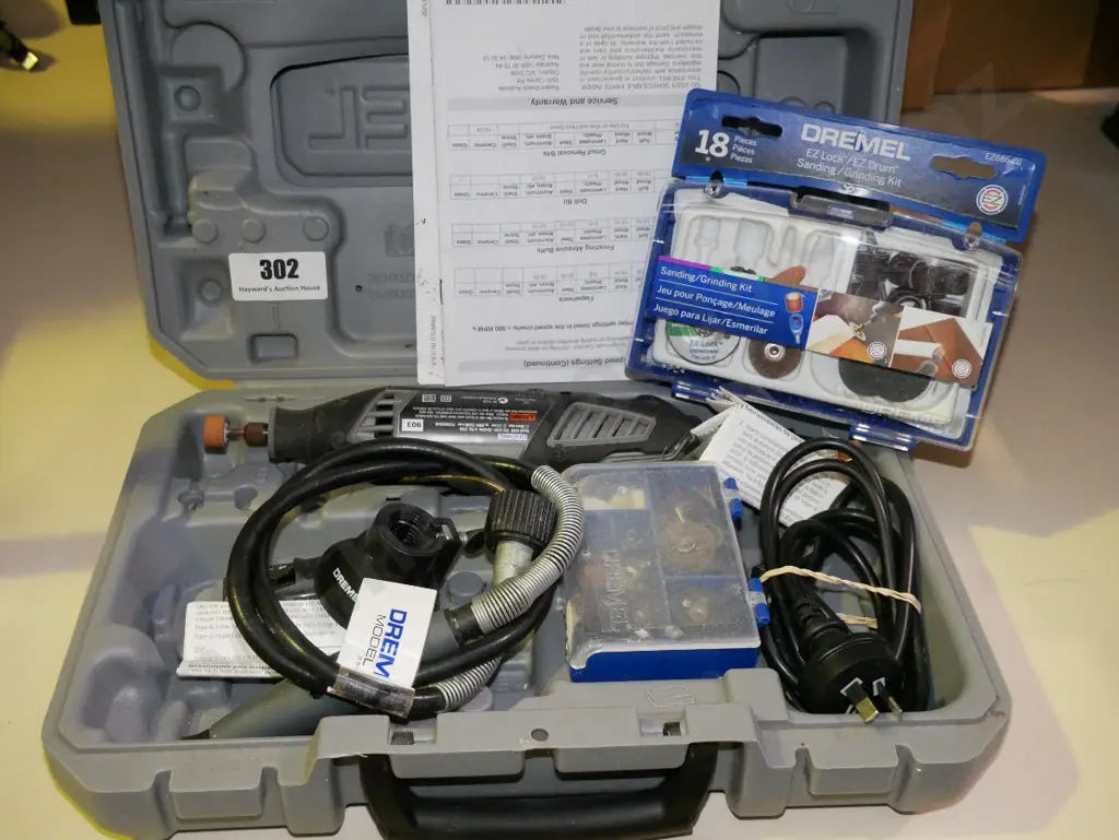 cased Dremel grinding tool and accessories Image 1++