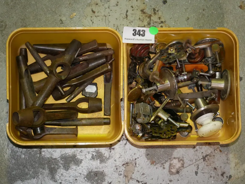 2 plastic tubs; various punches and cupboard door handles - green dots Image 1++