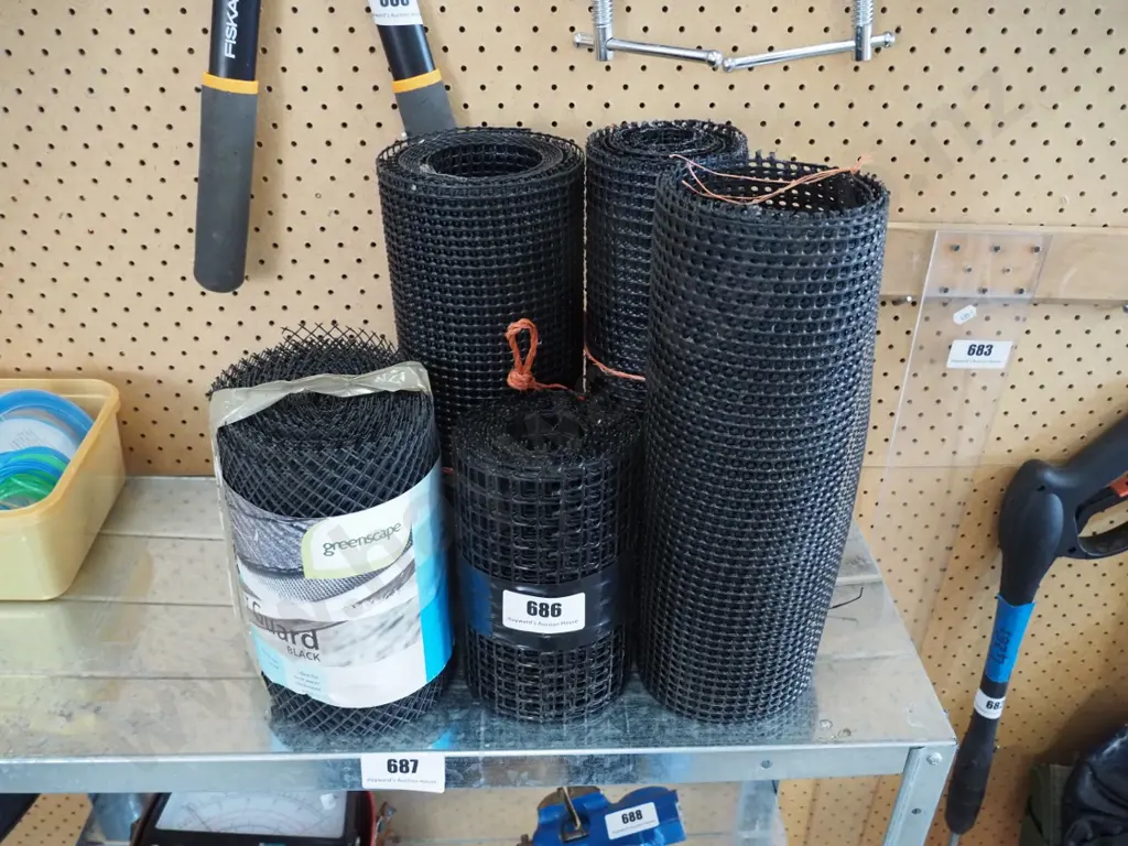 bundles of black plastic gutter guard Image 1++