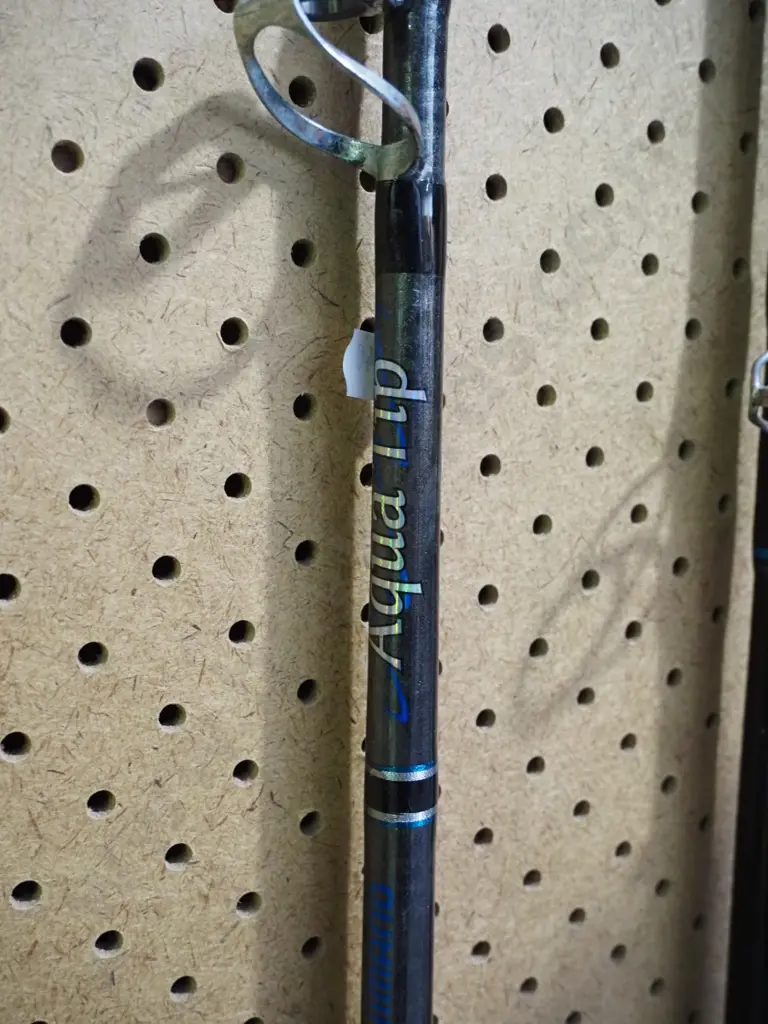 fishing rod, fishing rod and reel - some rust on reel - yellow dots Image 1++