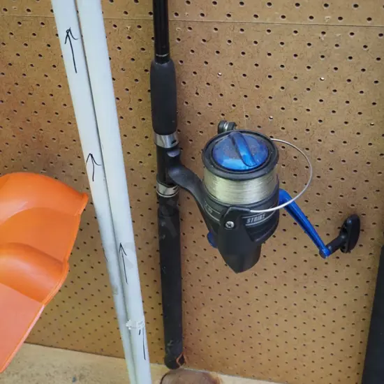 fishing rod and reel, 2 fishing jigs in pvc piping