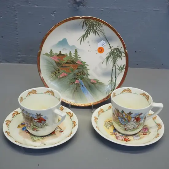 2 Royal Doulton Bunnykins cups & saucers and a Satsuma small display plate D-190
