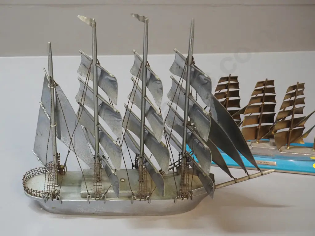 2 retro chromed steel sailing ship models, one on turquoise glass and metal base marked 'Pamir" - some pitting to chome Image 1++