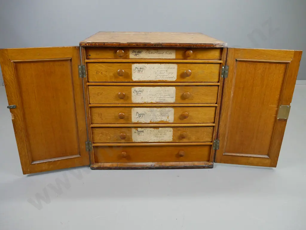 oak 2-door Masonic chest with 6 internal drawers, top one lined and divided, brass lock and escutcheons, panelled door Image 1++