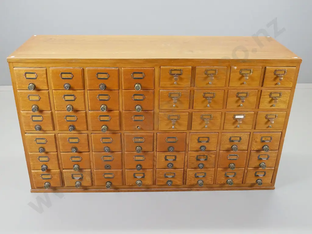 vintage oak set of 48 office drawers with mismatched brass knobs and nameplates Image 1++