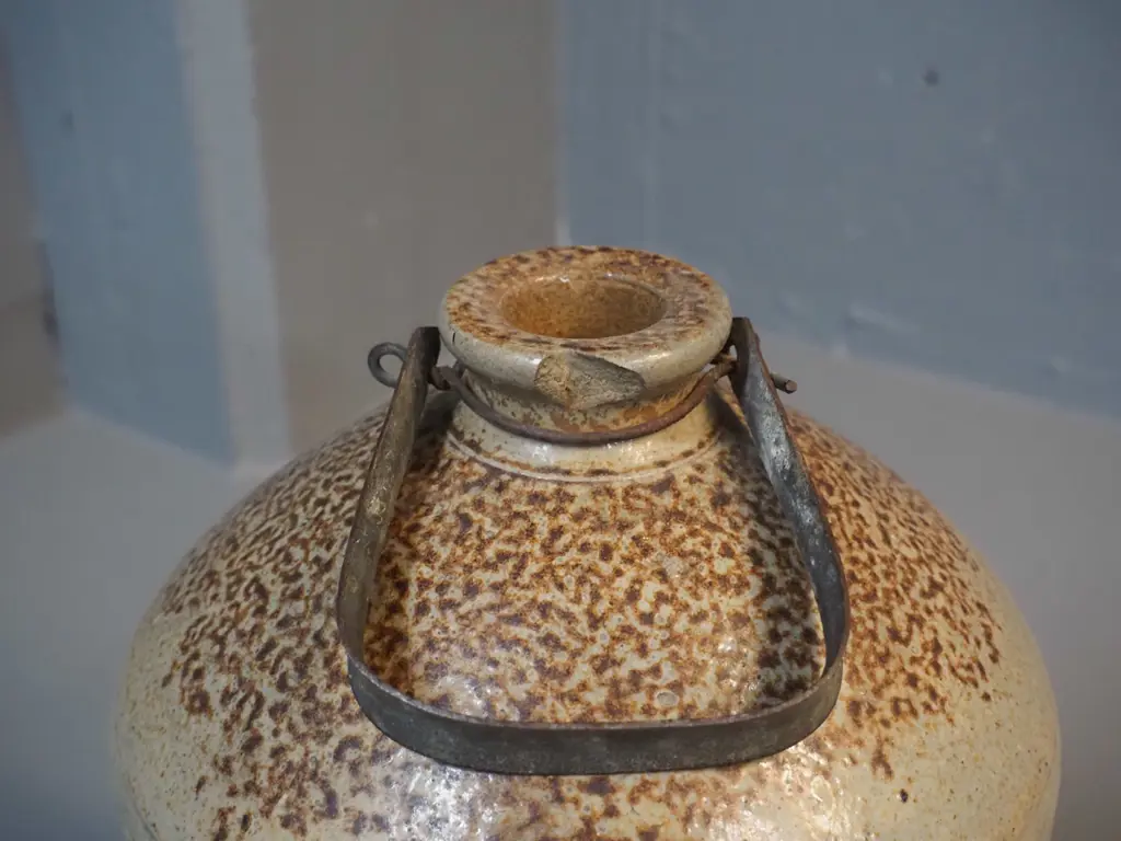 narrow-mouth stoneware crock with metal handle - marked Kempthorne Prosser Dunedin - small chip to mouth H-370 D-210 Image 1++