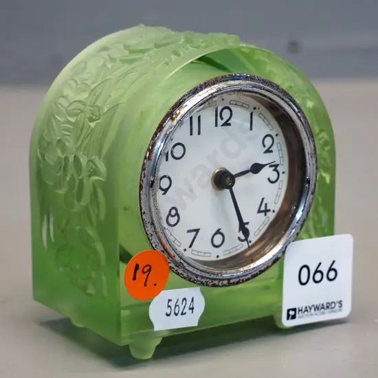 vintage green uranium glass clock with moulded flower pattern - some corrosion to chrome clock front H85 W75