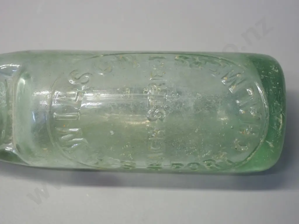 vintage green glass marble bottle - S H Wilson - Beach Street Port Chalmers, chip under rim H-225 Also marked Montgomery Image 1++