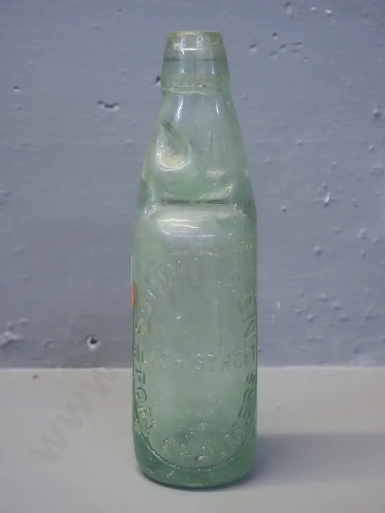 vintage green glass marble bottle - S H Wilson - Beach Street Port Chalmers, chip under rim H-225 Also marked Montgomery Image 1++
