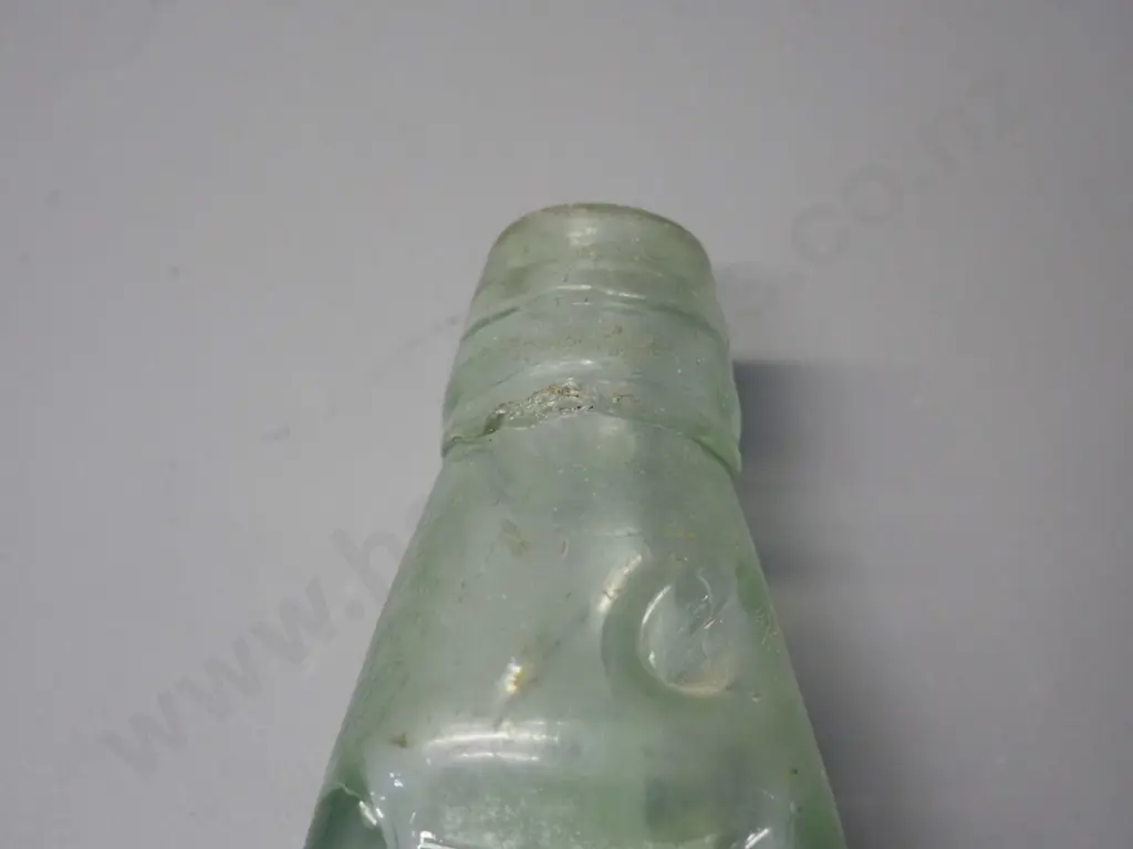vintage green glass marble bottle - S H Wilson - Beach Street Port Chalmers, chip under rim H-225 Also marked Montgomery Image 1++