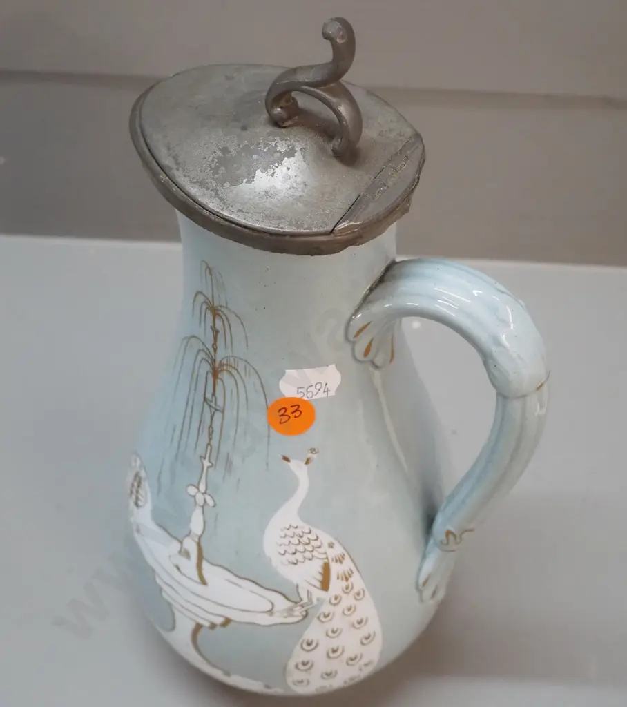 Victorian jug with pewter lid, peacock and fountain decoration, marked T&R Boote Patent Mosaic H-270. Discolouration to Image 1++