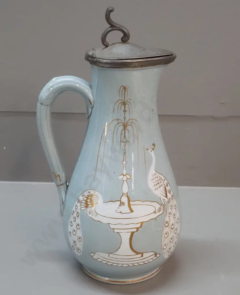Victorian jug with pewter lid, peacock and fountain decoration, marked T&R Boote Patent Mosaic H-270. Discolouration to Image 1++