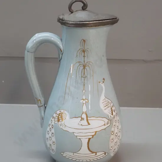 Victorian jug with pewter lid, peacock and fountain decoration, marked T&R Boote Patent Mosaic H-270. Discolouration to