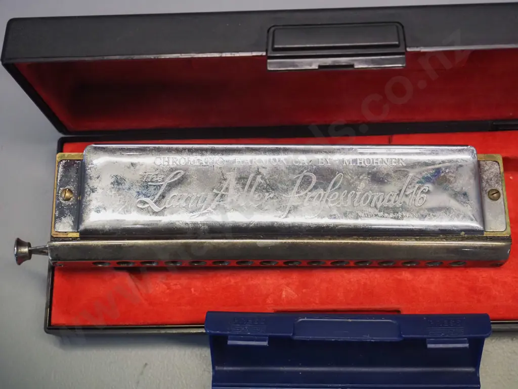 2 Hohner harmonicas in plastic cases - larger Larry Adler Professional 16 in C and a smaller Blues Harp MS in C Image 1++