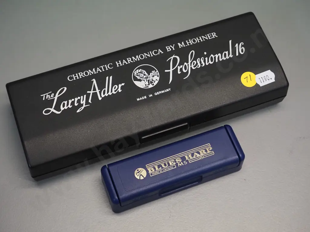2 Hohner harmonicas in plastic cases - larger Larry Adler Professional 16 in C and a smaller Blues Harp MS in C Image 1++