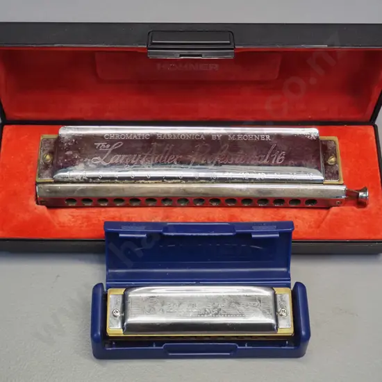 2 Hohner harmonicas in plastic cases - larger Larry Adler Professional 16 in C and a smaller Blues Harp MS in C