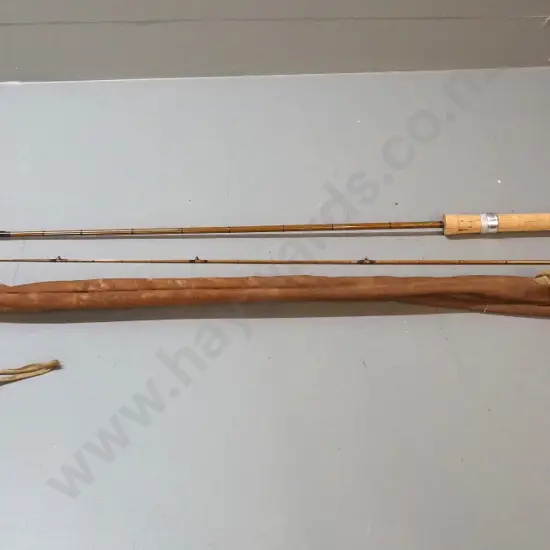 vintage 2-piece Apollo tubular steel fly fishing rod with canvas sleeve