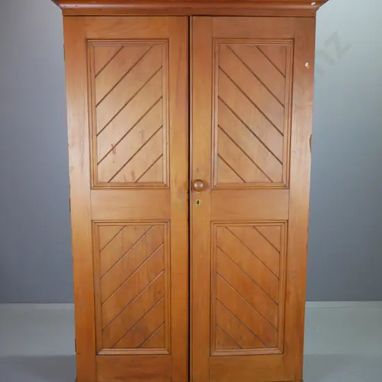 colonial kauri 2-door cupboard with herringbone T&G panels, 6 shelves, cornice top and plinth base, brass escutcheon,