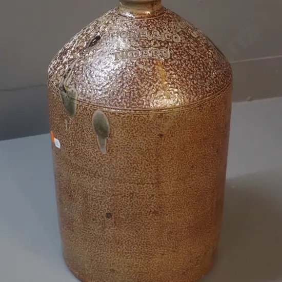 narrow-mouth stoneware crock marked J Hole & Co Timaru / 2 Gallons Liquor - has small chip to mouth H-370 D-220