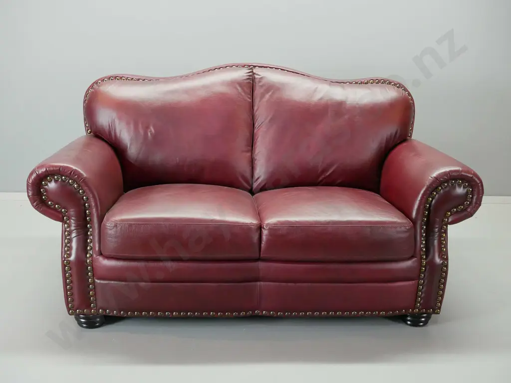 red leather hump backed rolled arm suite comprising a 3 and a 2 -seater Image 1++