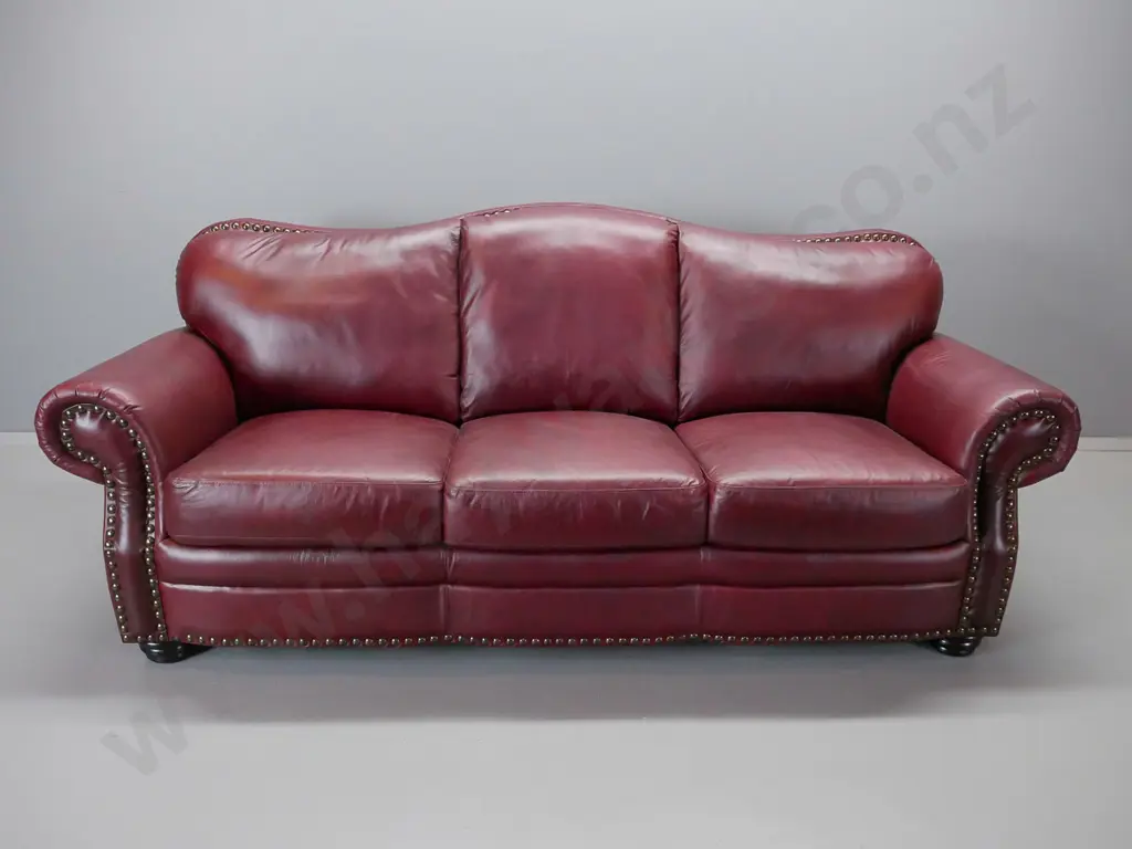 red leather hump backed rolled arm suite comprising a 3 and a 2 -seater Image 1++