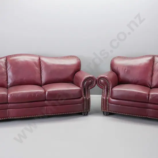 red leather hump backed rolled arm suite comprising a 3 and a 2 -seater
