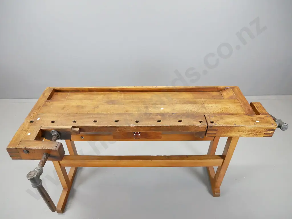 sloped top oak and elm continental workbench having wooden vice at either end on new refrectory base Image 1++