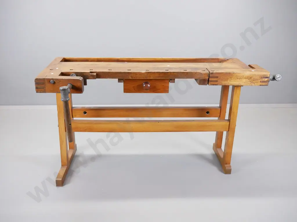 sloped top oak and elm continental workbench having wooden vice at either end on new refrectory base Image 1++