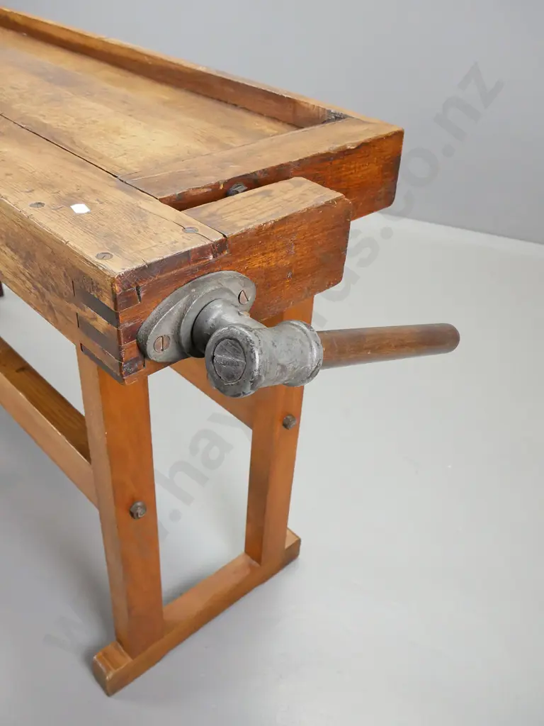 sloped top oak and elm continental workbench having wooden vice at either end on new refrectory base Image 1++