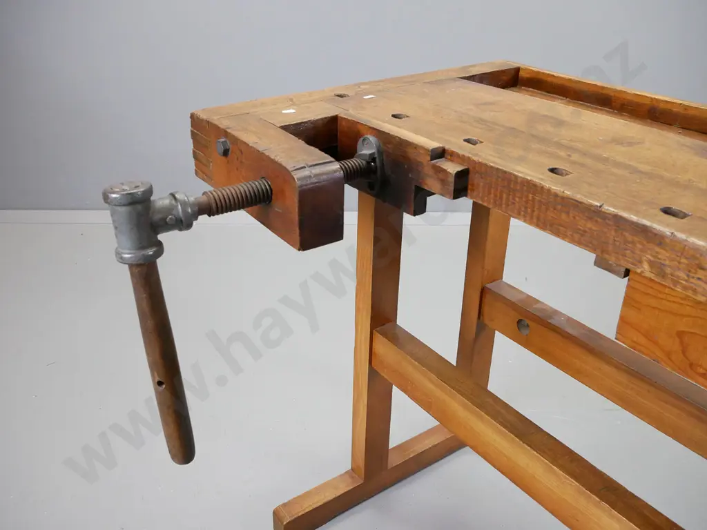 sloped top oak and elm continental workbench having wooden vice at either end on new refrectory base Image 1++