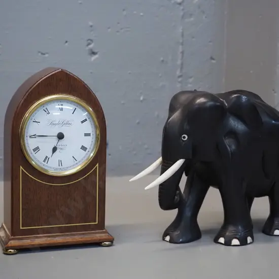 mahogany cased small mantel clock Knight & Gibbins w/ battery quartz movement, H175 and an ebony elephant H-150 L-200