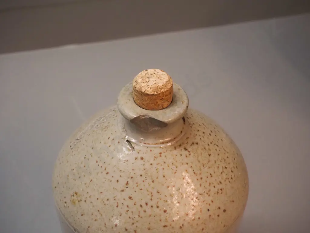 small narrow-mouth stoneware crock with cork stopper - marked D. Stewart & Co Green Island - chip to mouth H-330 D-180 Image 1++