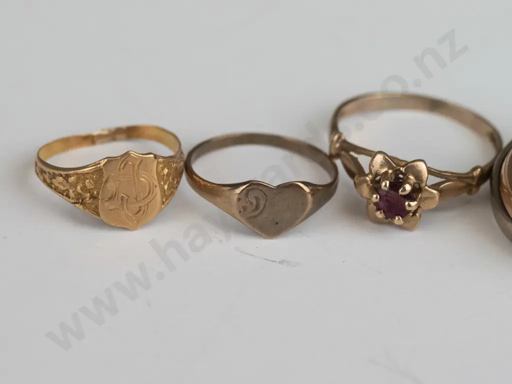 18ct Russian roller ring yellow/ white/rose gold 6.3gms, 9ct heart ring .8gms, 9ct red stone1.3gms,& 9ct ring 8gms Image 1++