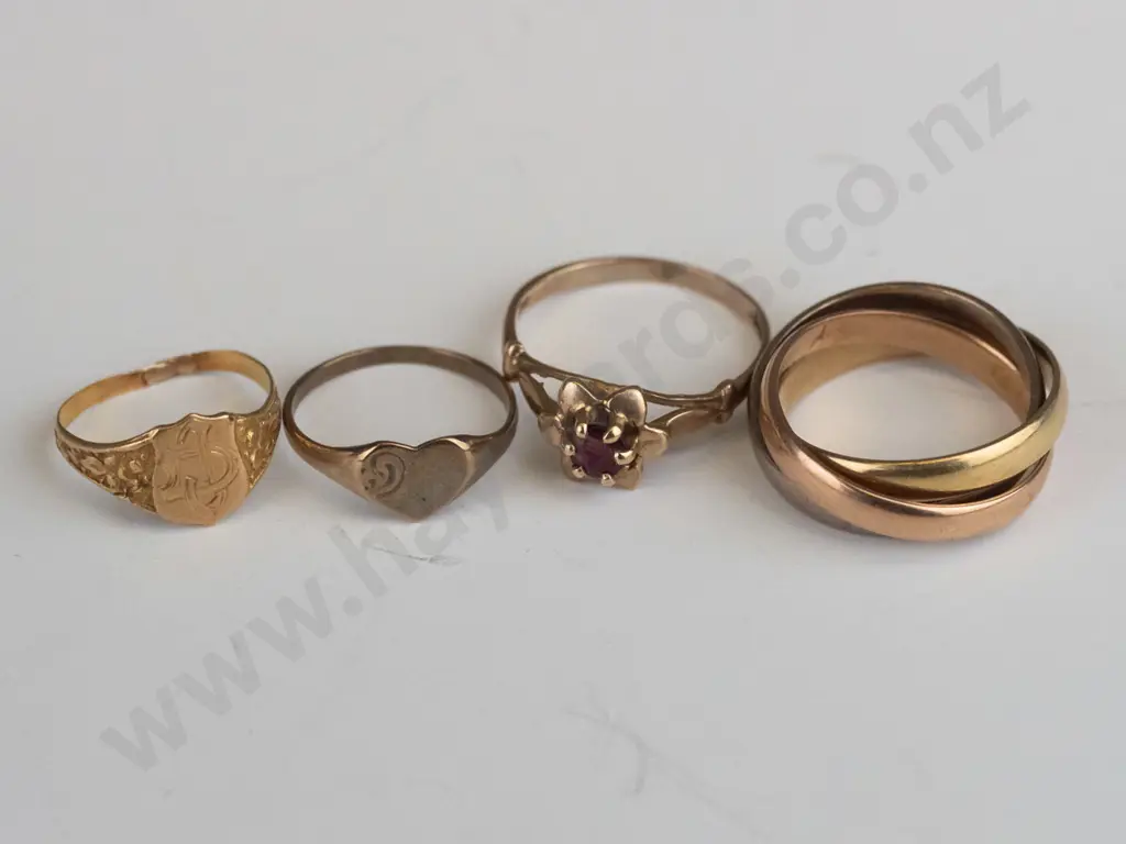 18ct Russian roller ring yellow/ white/rose gold 6.3gms, 9ct heart ring .8gms, 9ct red stone1.3gms,& 9ct ring 8gms Image 1++