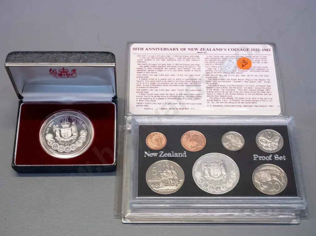 New Zealand coins - 1983 50th Anniversary of NZ coinage proof set and 1983 proof dollar in plastic case Image 1++
