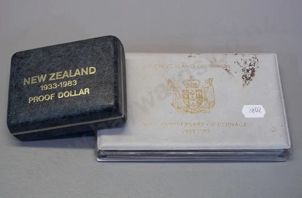 New Zealand coins - 1983 50th Anniversary of NZ coinage proof set and 1983 proof dollar in plastic case Image 1++
