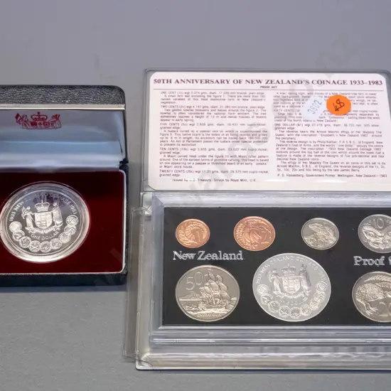 New Zealand coins - 1983 50th Anniversary of NZ coinage proof set and 1983 proof dollar in plastic case