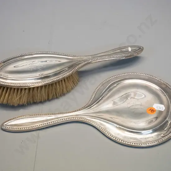 sterling silver dressing table mirror and brush - both monogrammed AJ, mirror is L-270, has adhesive residue on glass