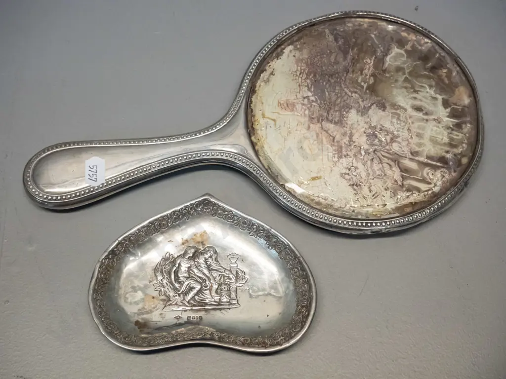 sterling silver dressing table hand mirror w/1912 inscription, and a small dish with embossed figural design Image 1++