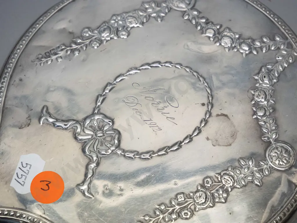 sterling silver dressing table hand mirror w/1912 inscription, and a small dish with embossed figural design Image 1++