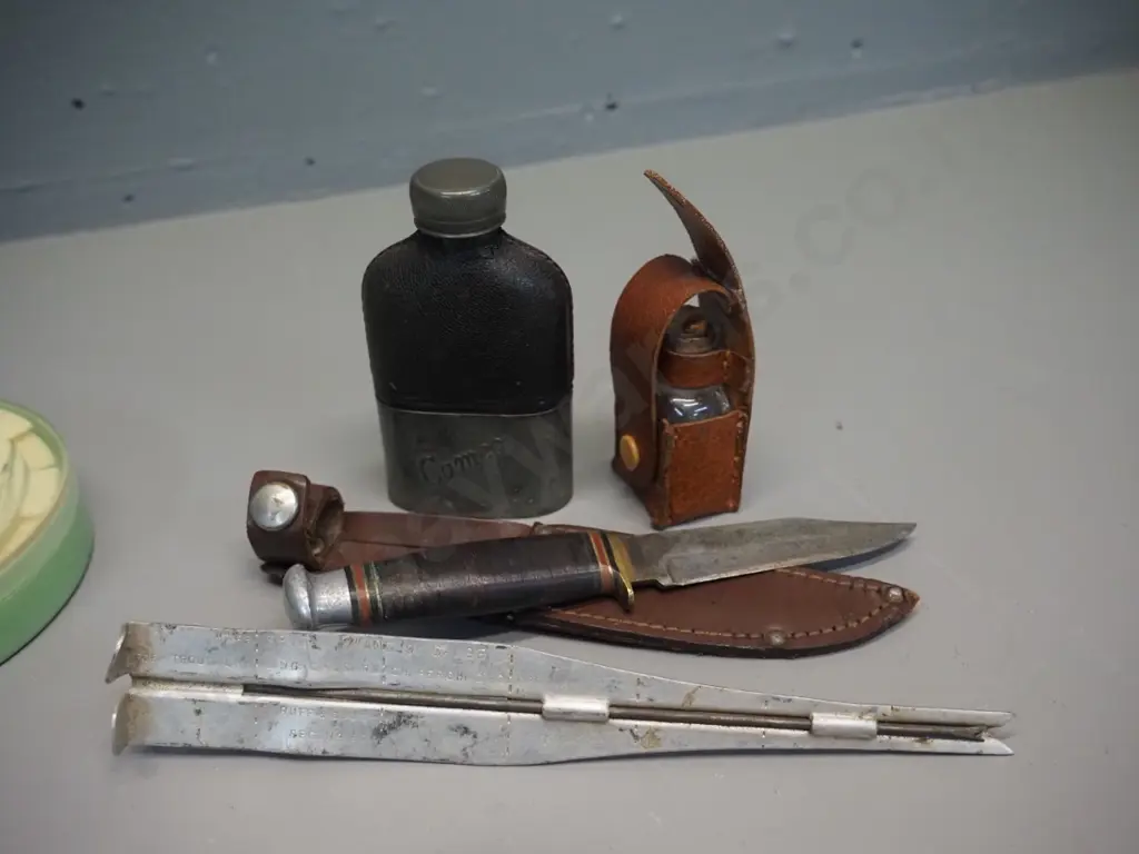small glass dry fly oil bottle and small knife in leather sheaths, small metal and leather covered glass flask marked Image 1++