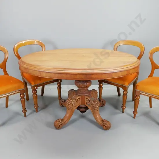 colonial oval tilt-top loo table on 4 point heavily carved pedestal base w/four  rimu and kauri balloon back chairs,
