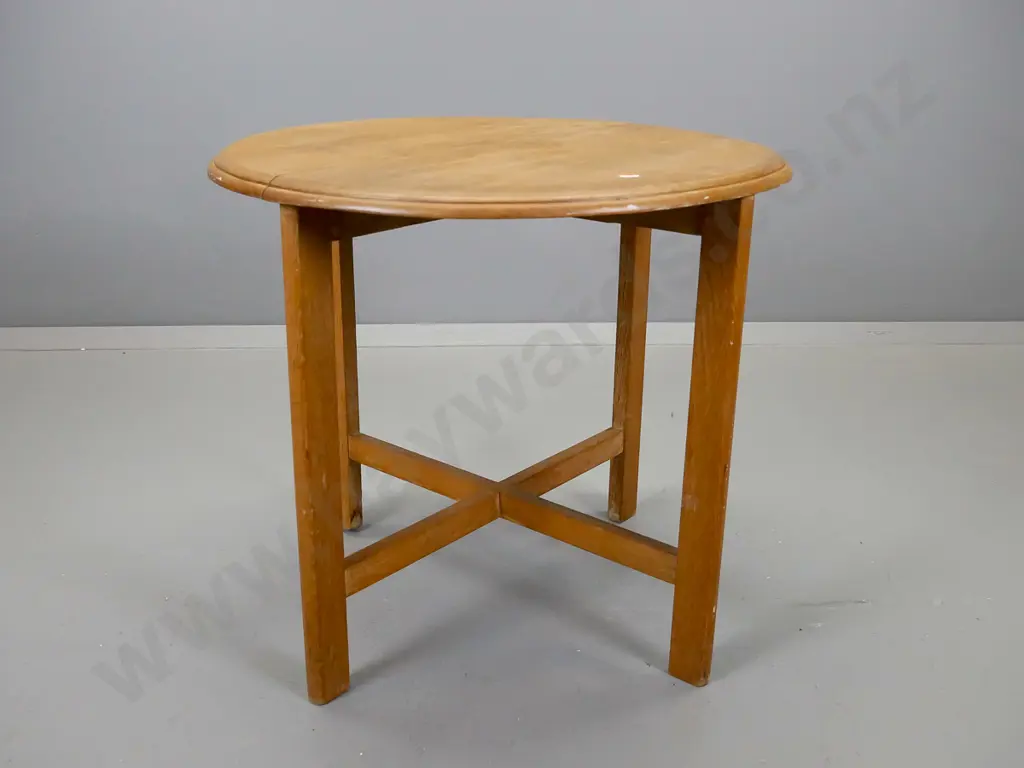 round oak occasional table, having four legs on x-frame base, crack and water stains to top Image 1++
