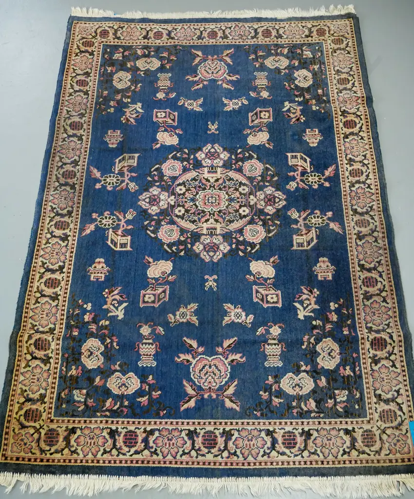blue ground oriental rug, floral central medallion surrounded by floral decoration, pink and blue floral border Image 1++